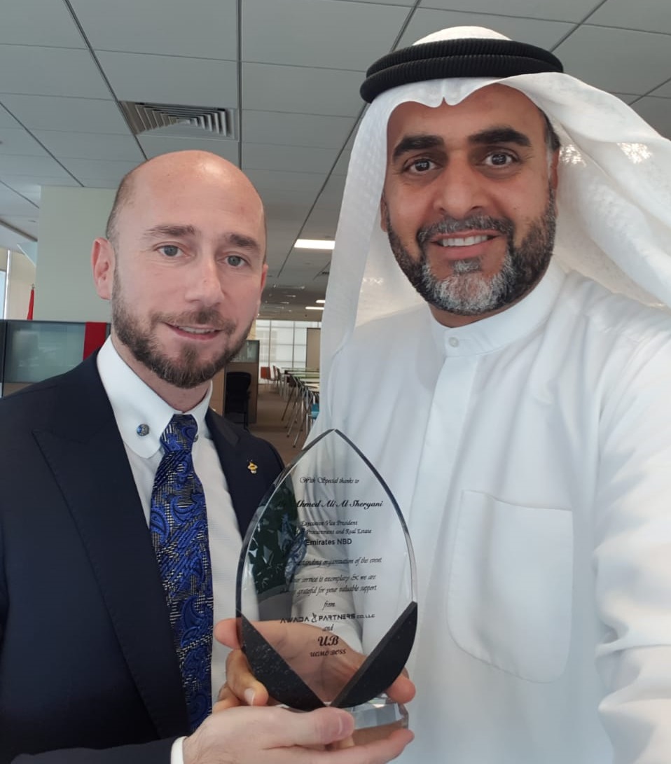 Mr. Ahmed Awada honor delivering an appreciation award to Mr. Ahmed Alsheryani the Executive Vice President head of procurement and real estate in Emirates NBD.jpg